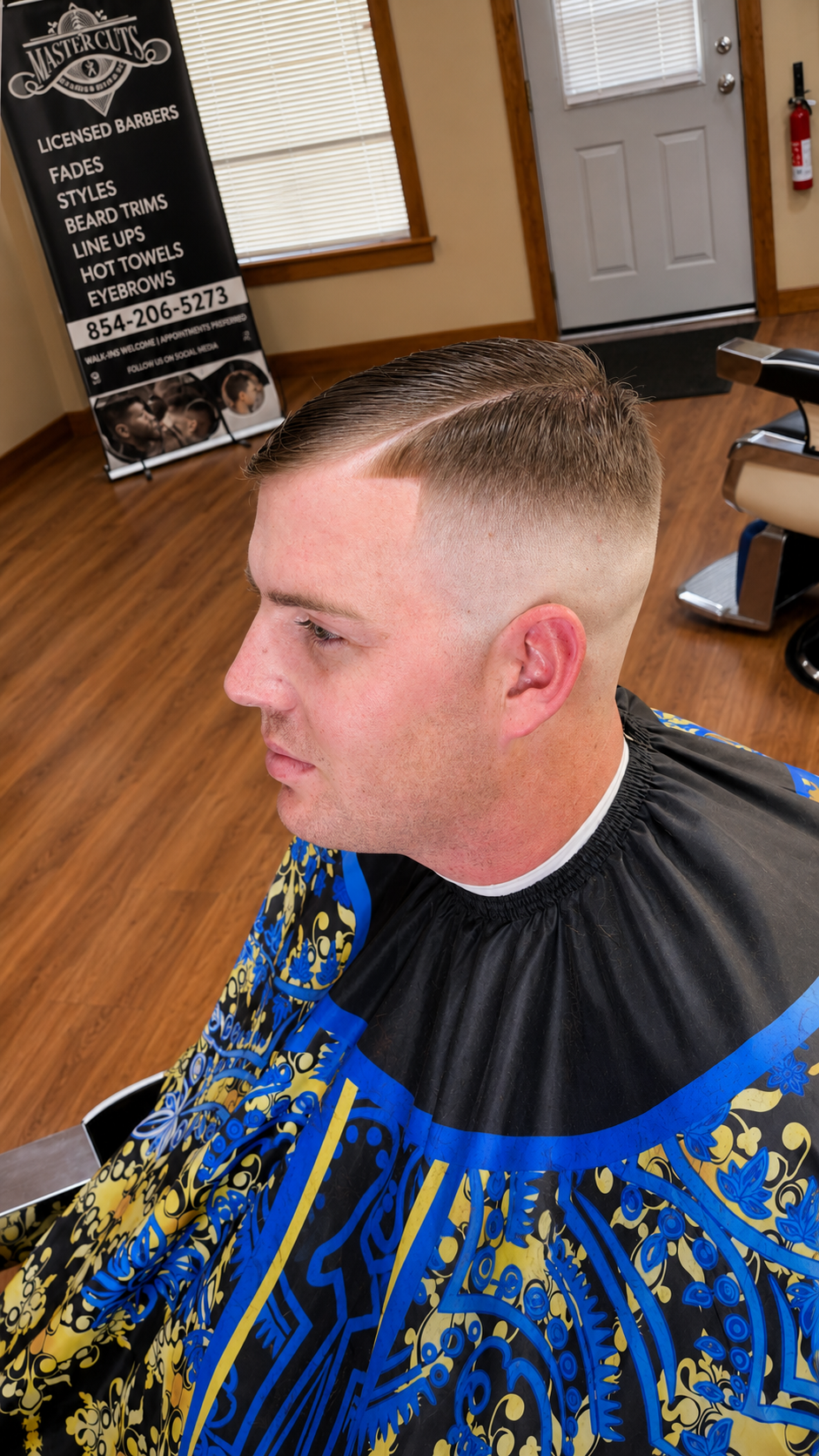 High fade with a hard part